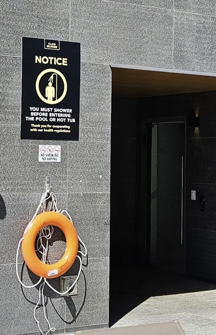 Pool entrance and shower notice