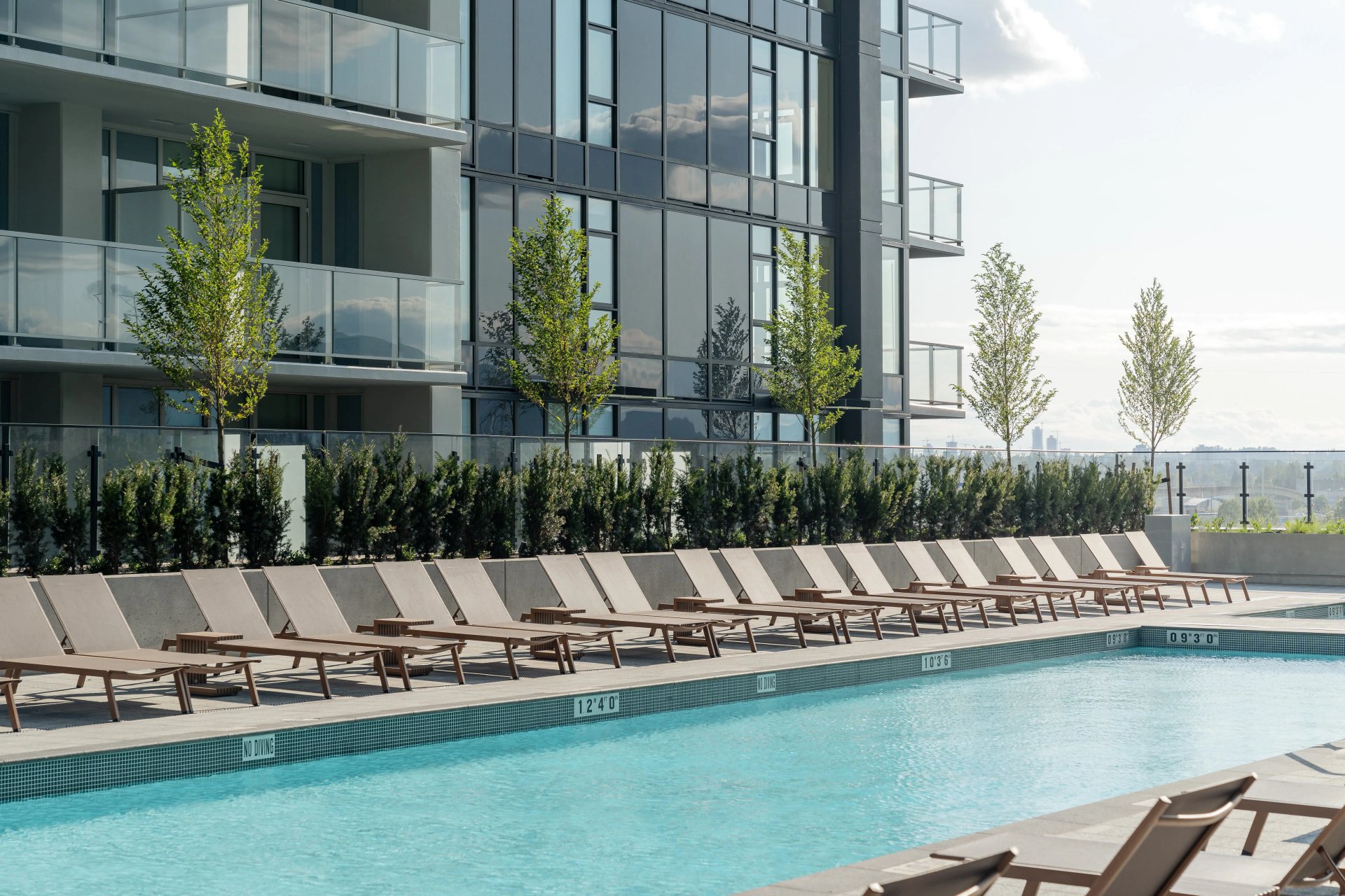 Outdoor pool and sun deck at Club Gilmore